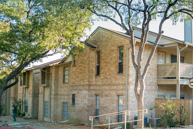 view of building exterior with central AC unit