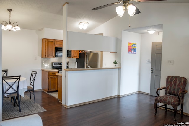 kitchen featuring lofted ceiling, tasteful backsplash, stainless steel appliances, and dark hardwood / wood-style flooring