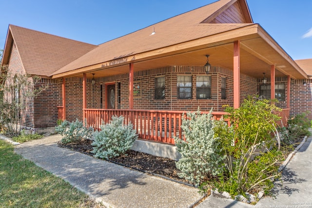 view of property exterior with a porch