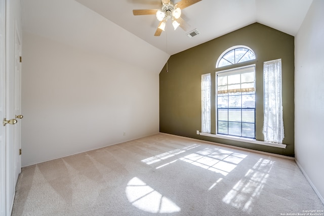 additional living space featuring vaulted ceiling, light colored carpet, and ceiling fan