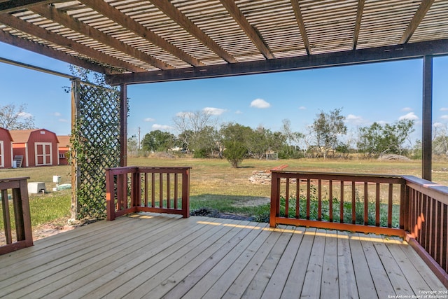 wooden deck with a pergola and a lawn