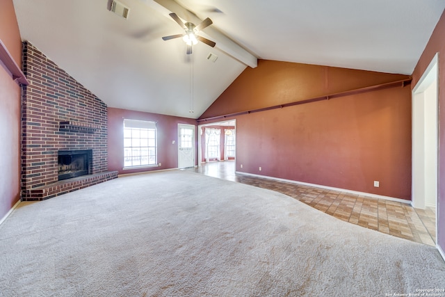 unfurnished living room featuring carpet floors, high vaulted ceiling, beamed ceiling, ceiling fan, and a fireplace