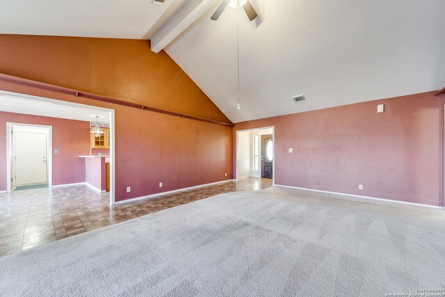 empty room with ceiling fan, beam ceiling, light carpet, and high vaulted ceiling