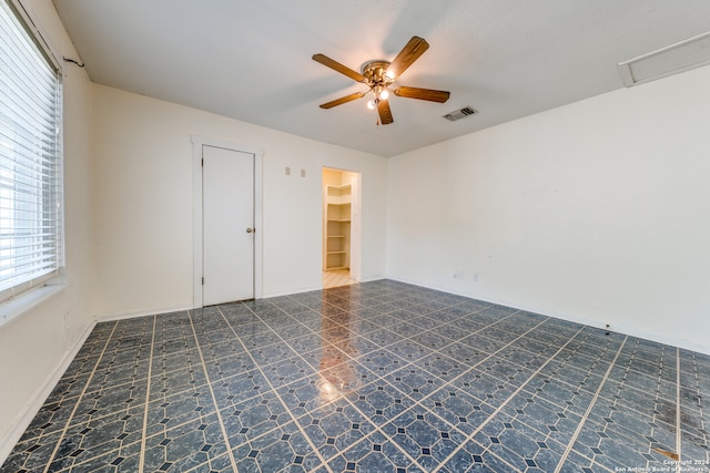 spare room with ceiling fan