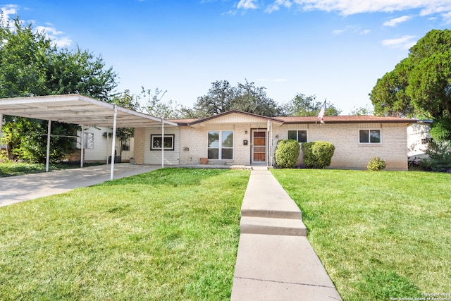 ranch-style house with a front lawn and a carport