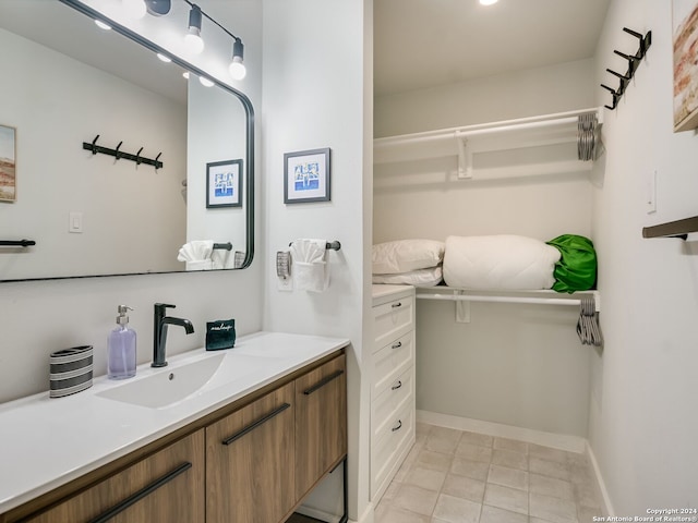 bathroom with vanity and tile patterned floors