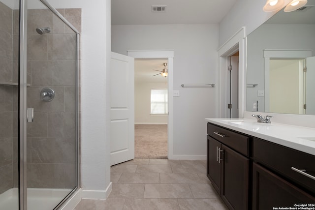 bathroom with vanity, an enclosed shower, tile patterned floors, and ceiling fan