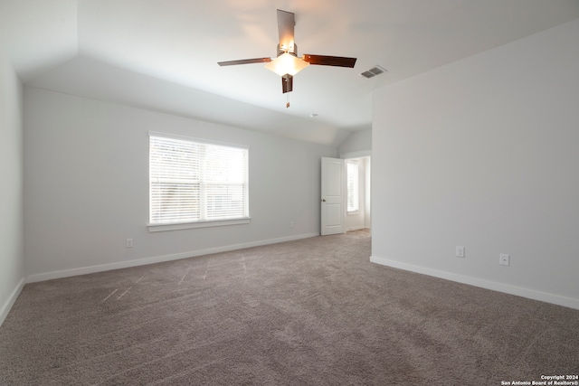 spare room featuring ceiling fan, carpet flooring, and lofted ceiling