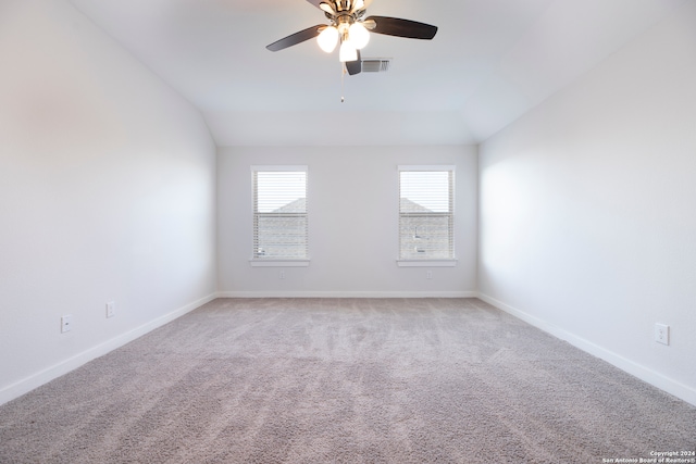 unfurnished room featuring ceiling fan, carpet flooring, and vaulted ceiling