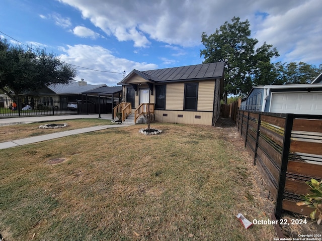 view of front facade with a front yard and a garage