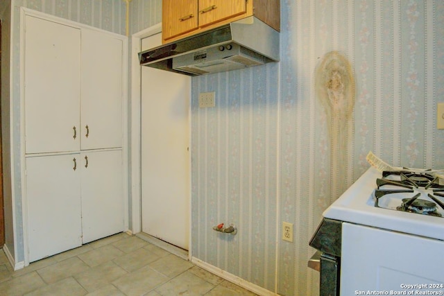 kitchen featuring light brown cabinets and light tile patterned flooring