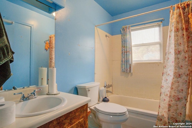 full bathroom with vanity, toilet, and shower / tub combo