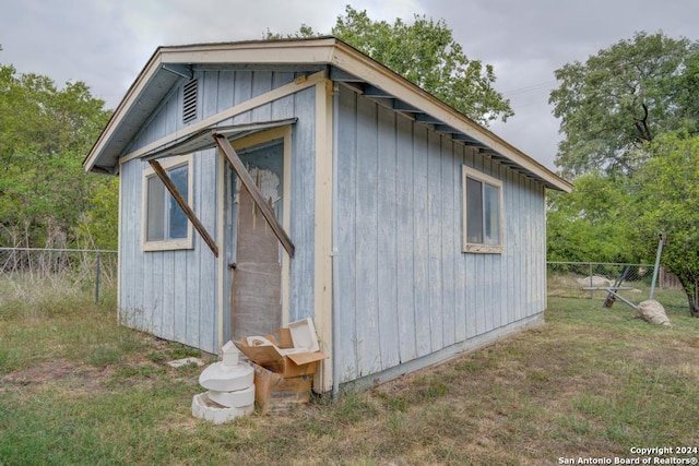 view of outdoor structure with a lawn