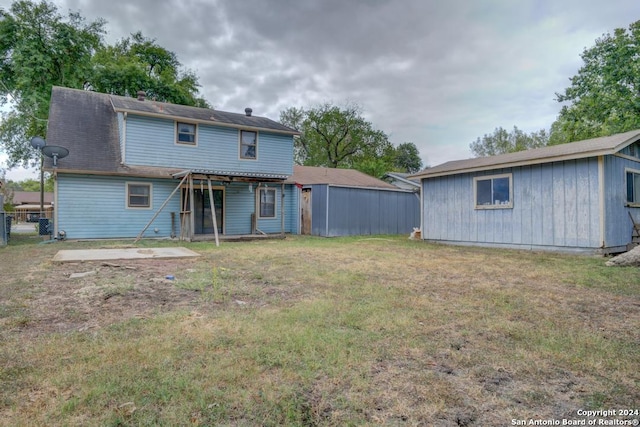 back of house with a yard