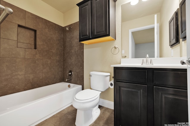 full bathroom with vanity, tiled shower / bath combo, toilet, and tile patterned floors