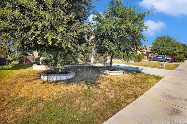 view of yard featuring central air condition unit