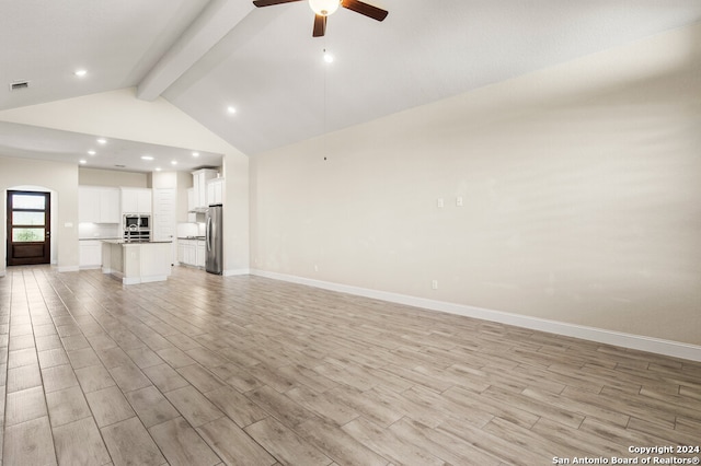 unfurnished living room featuring vaulted ceiling with beams, light wood-type flooring, and ceiling fan