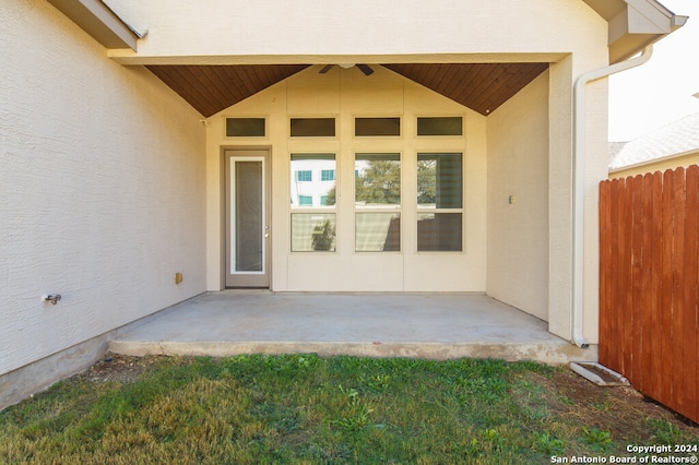 entrance to property featuring a patio