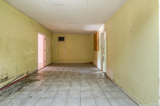 corridor with a textured ceiling