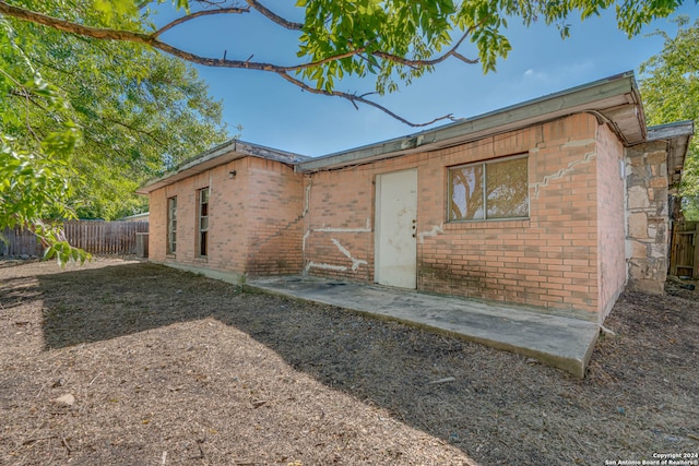 back of house with a patio area