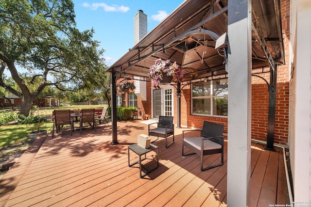 wooden deck featuring a gazebo