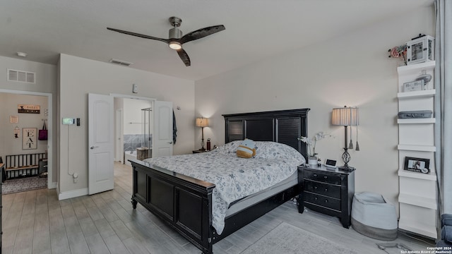 bedroom with ceiling fan and light hardwood / wood-style floors