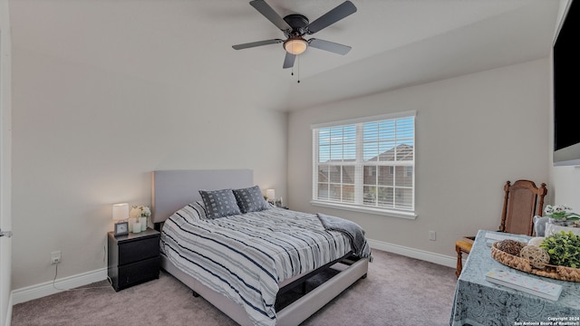 bedroom featuring ceiling fan, light carpet, and vaulted ceiling