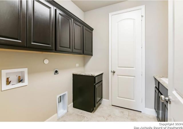 washroom featuring cabinets, hookup for an electric dryer, and hookup for a washing machine