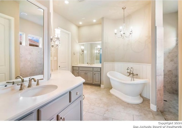 bathroom featuring vanity, tile patterned floors, independent shower and bath, and a chandelier