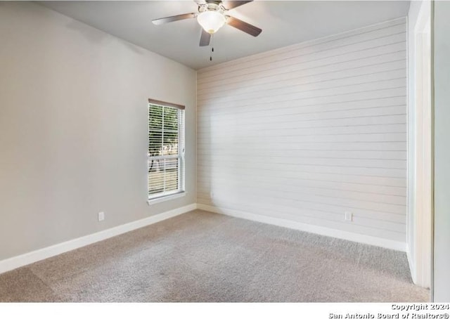 carpeted empty room with ceiling fan