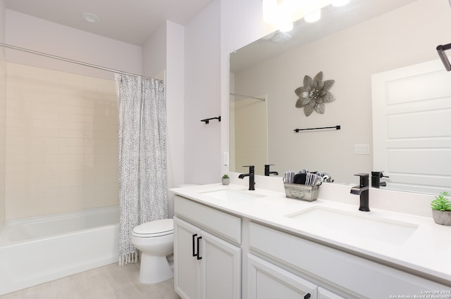 full bathroom with vanity, shower / tub combo with curtain, and toilet