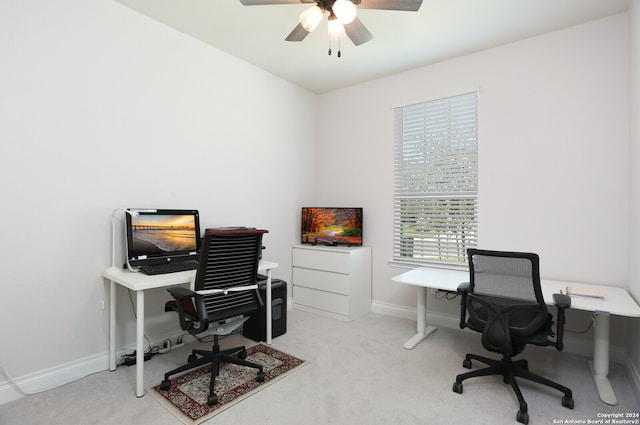 carpeted home office with ceiling fan