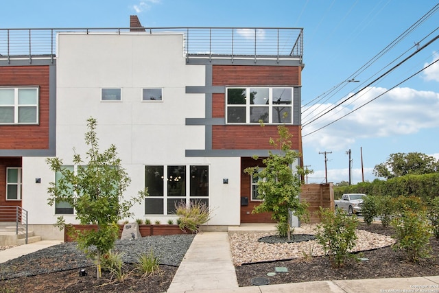 contemporary home with a balcony