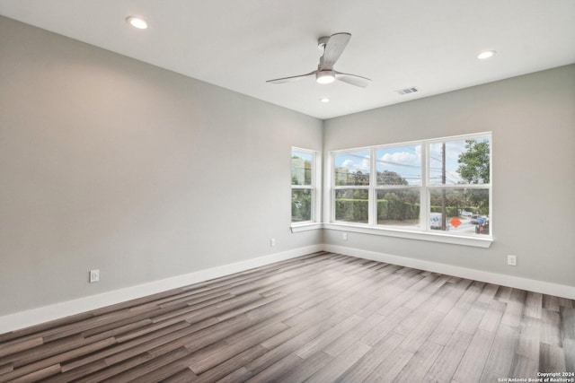 159 E Davis Ct Unit 102, San Antonio, TX 78209 - spare room with baseboards, recessed lighting, ceiling fan, and wood finished floors