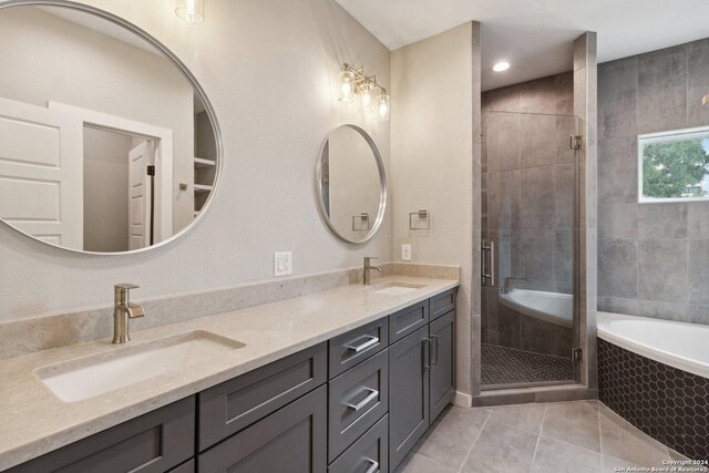 159 E Davis Ct Unit 102, San Antonio, TX 78209 - bathroom featuring double vanity, a sink, a stall shower, and tile patterned floors