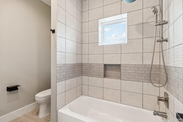 159 E Davis Ct Unit 102, San Antonio, TX 78209 - full bathroom featuring baseboards, shower / tub combination, wood finished floors, and toilet