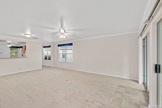 unfurnished living room with a wealth of natural light, crown molding, light carpet, and ceiling fan