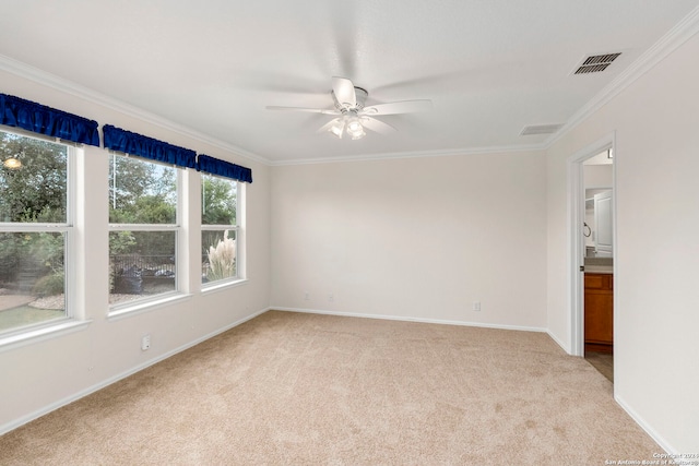 unfurnished room with crown molding, light carpet, and ceiling fan