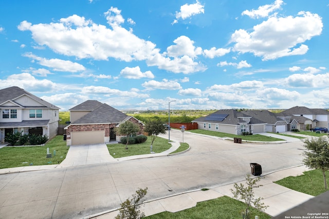 view of front of property with a front yard and a garage