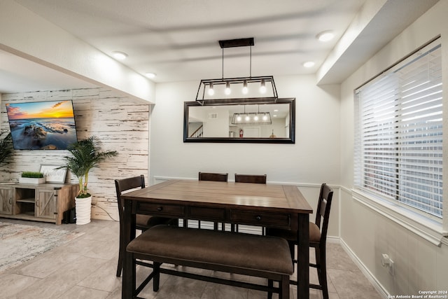 dining area with light tile patterned floors