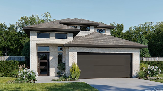 view of front of house featuring concrete driveway, brick siding, and an attached garage