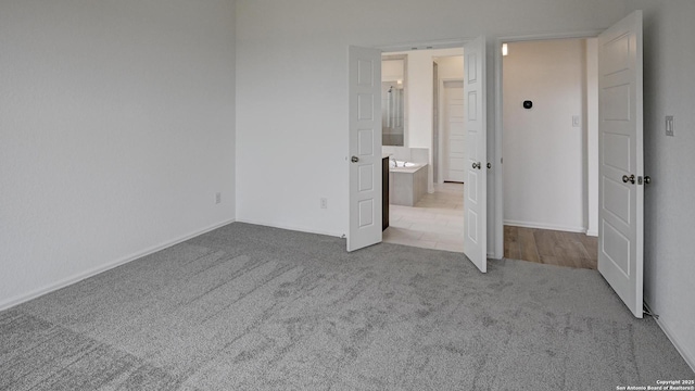 unfurnished bedroom featuring carpet flooring