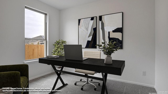 carpeted home office with baseboards