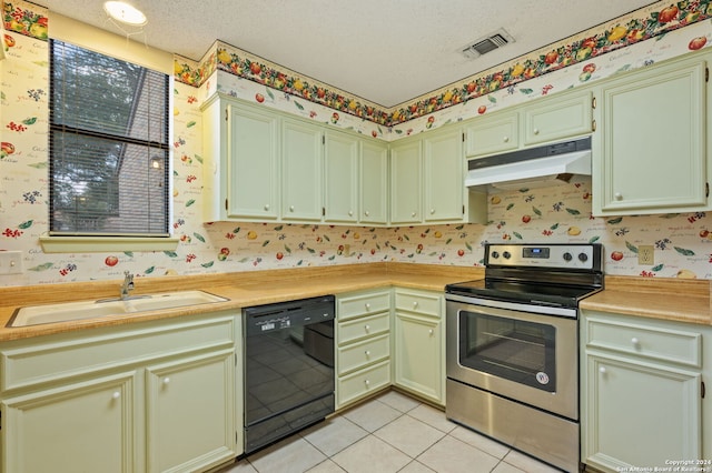 kitchen featuring black dishwasher, sink, a textured ceiling, stainless steel electric range, and light tile patterned floors