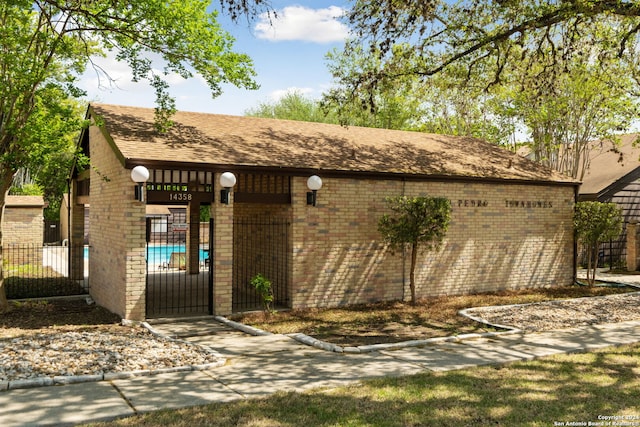 doorway to property with a fenced in pool