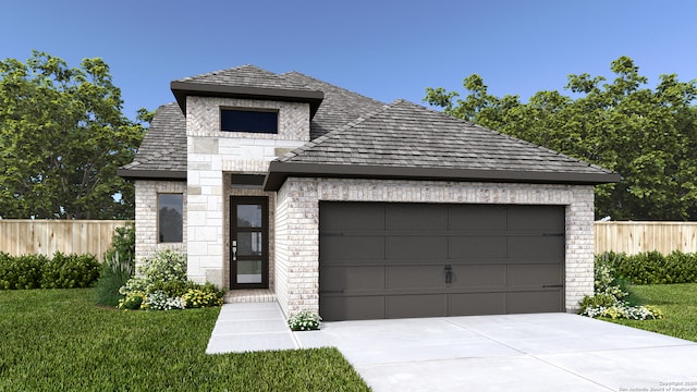 french country home with brick siding, fence, a front yard, driveway, and an attached garage