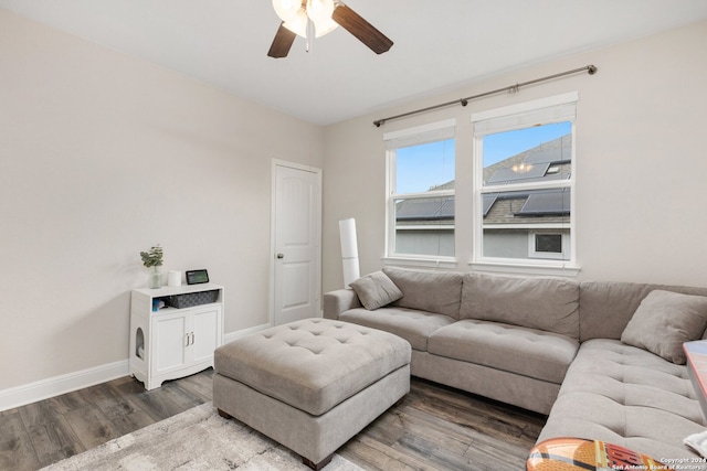 living room featuring dark hardwood / wood-style floors and ceiling fan