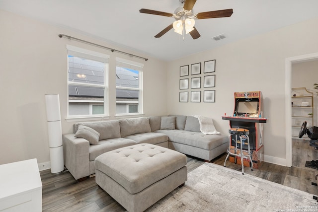 living room featuring hardwood / wood-style flooring and ceiling fan