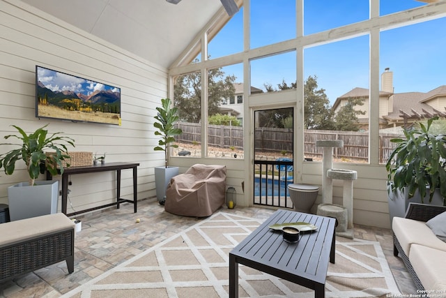 sunroom / solarium with vaulted ceiling