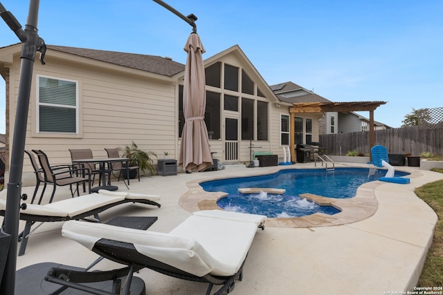 view of pool featuring a patio area and a grill